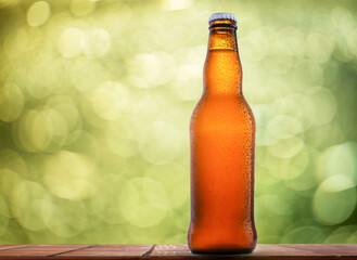 Bottle of beer on a natural background