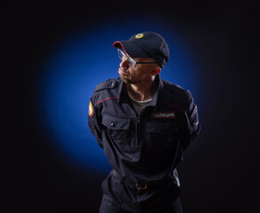 a guy in a police uniform is a Russian policeman. English translation of 
