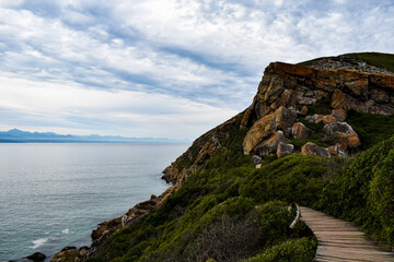 Walkway along a cliff above the ocean.