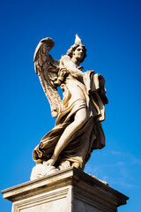 Naklejka premium Romantic statue of an angel on the Sant Angelo bridge in Rome