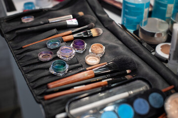 Makeup cosmetics. Work set for a beautician. Brushes, palettes, blush, pigments, eye shadow,...