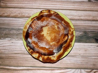 Pancakes with sugar on a plate.