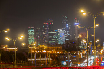 Fototapeta na wymiar Moscow city skyline and blurred traffic at twilight
