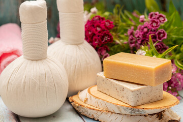 Spa herbal compresses with soap and facial towels