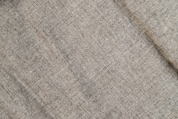 Natural linen texture. Stone washed pure linen texture. Wrinkled linen fabric background.