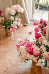 bouquets of peonies at home near balkony