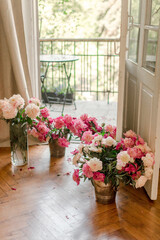 bouquets of peonies at home near balkony