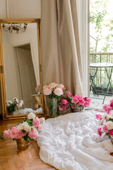 bouquets of peonies at home near balkony