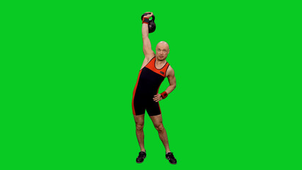 Fototapeta na wymiar Male athlete pushing kettlebell by one hand on green screen background, chroma key