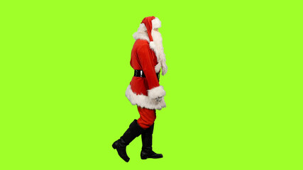 Side view of walking Santa against green screen background, Chroma key