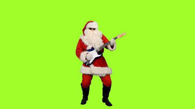 Santa Claus rock star in sunglasses playing guitar on green screen background - Powered by Adobe