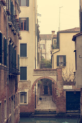 Narrow canal with boats parked ready for tourists.