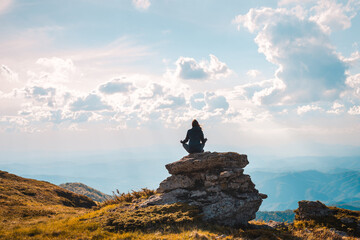 Woman doing yoga in nature.