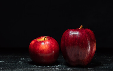 red apples on a black background