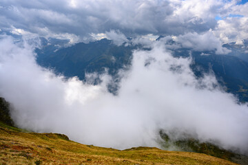 Fototapeta na wymiar Österreich, Montafon, Schruns, Landschaft mit Wolken bei der Wormser Hütte.