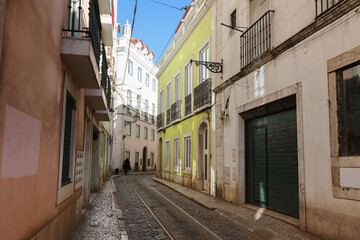Fototapeta na wymiar narrow street in the city centre with tram rails in Portugal
