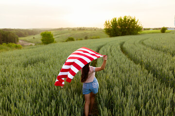 Independence day concept with woman lying down on american flag