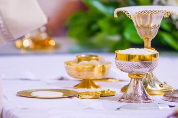 altar with host and chalice with wine in the churches of the pope of rome, francesco