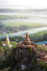 Naklejka premium High view of Khao Na Nai Luang temple with the colorful sky in the morning at Surat Thani Province, Southern of Thailand