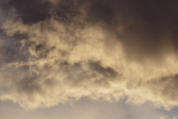 Stormy rain big fluffy clouds. Dark sky. Natural scenic abstract background. Weather changes backdrop. Sky filled with voluminous clouds.