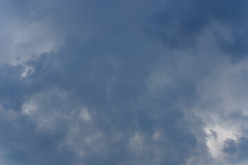 Stormy rain big fluffy clouds. Dark sky. Natural scenic abstract background. Weather changes backdrop. Sky filled with voluminous clouds.