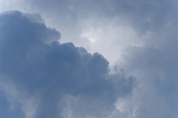 Stormy rain big fluffy clouds. Dark sky. Natural scenic abstract background. Weather changes backdrop. Sky filled with voluminous clouds.