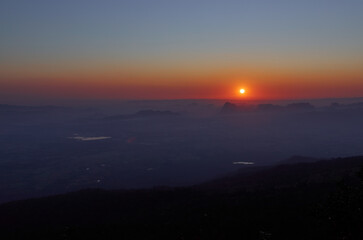 A sunshine lighted in the morning show the urban far always behind the mountain at Phu Kradueng.