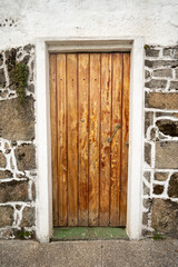 old wooden door in a stone wall