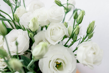 Bouquet of white flowers on white background