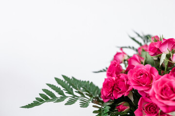 Bouquet of pink flowers on white background and space