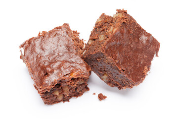 Brownie. Pieces of chocolate brownie with chopped nuts on a white background. Yummy chocolate cake