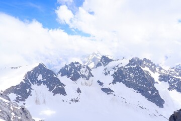 Fototapeta na wymiar The Alps mountain from the Titlis Peak in bright summer season in Engelberg, Switzerland
