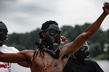 Portrait of man in gas mask at protest