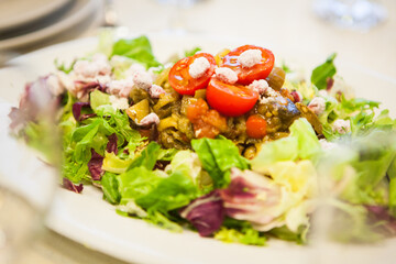 Mediterranean dish of vegetables, decorated with tomatoes