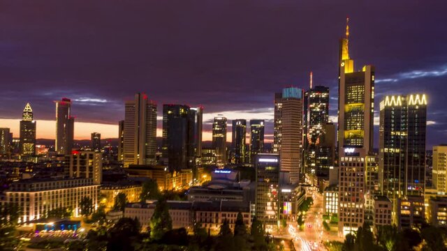 AERIAL: Night Hyper Lapse, Motion Time Lapse of Frankfurt am Main Germany Skyline view and beautiful city lights with Main River in foreground