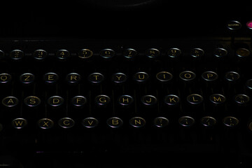 Detail of ancient typewriter on a black background