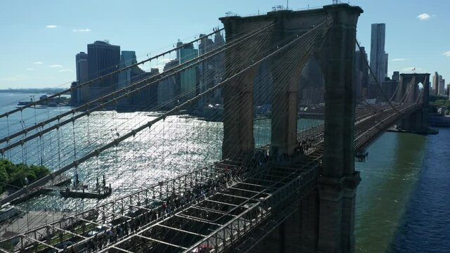 flying alongside Brooklyn Bridge as BLM demonstration marches across towards NYC