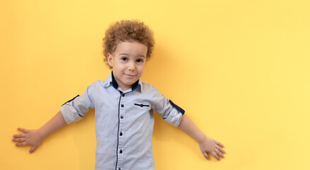 Portrait of boy with raised hands up