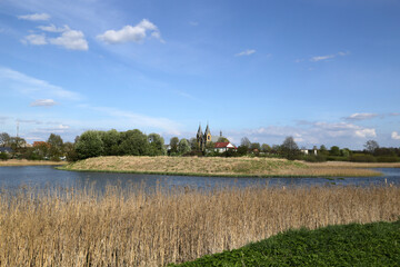 View of the city of Rakov in Belarus from the lake, which arose as a result of the construction of a dam on the Isloch River.