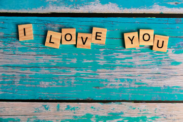 Top view I LOVE YOU word written on wood block. LOVE Wood word with copy space.