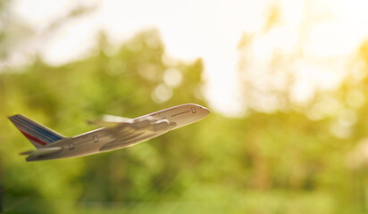 The concept of travel and plane flying and sunlight