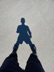 Shadow of man at skates 