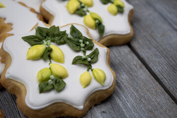 Lemon cookies decorated with royal icing on wooden background