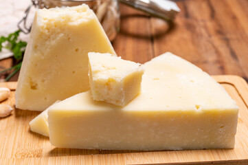 Pieces of matured pecorino romano italian cheese made from sheep milk in Lazio, Sardinia or Tuscany