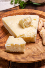 Pieces of matured pecorino romano italian cheese made from sheep milk in Lazio, Sardinia or Tuscany