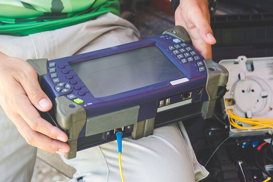 Internet technicians are measuring the light signal using the Optical Time Domain Reflectometer. To measure the termination of light for maintenance of fiber optics