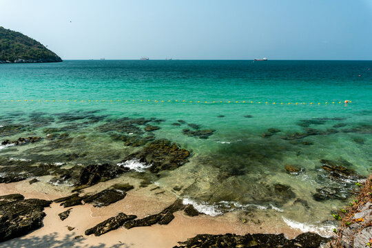 Beach rocks Beautiful sea water on clear blue day of Tham Phang beach, Ko Sichang, Chonburi, Thailand