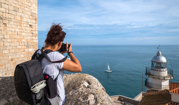 woman traveler landscape photography Peniscola with bridge camera Castellon Spain travel photo