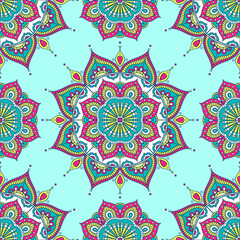 Vector seamless pattern with ethnic mandala. Tribal background with hand drawn doodle ornaments. On green background.