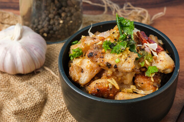 Fried chicken with garlic and pepper with rice. Thai Dish.